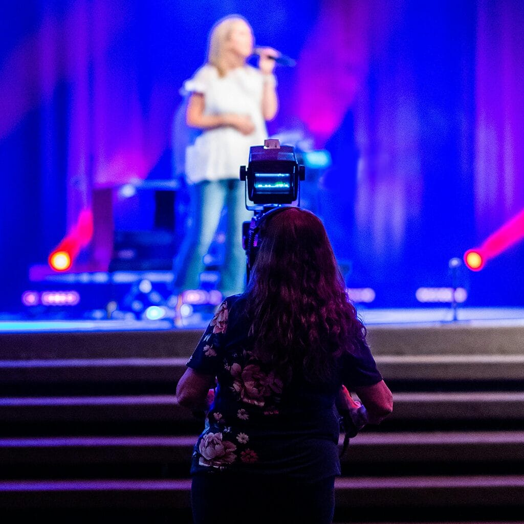 woman-filming-conference-for-a-hybrid-event.jpg