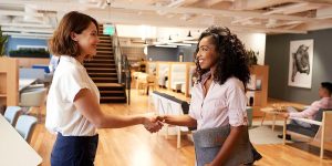 woman-shakes-hands-with-a-colleague.jpg